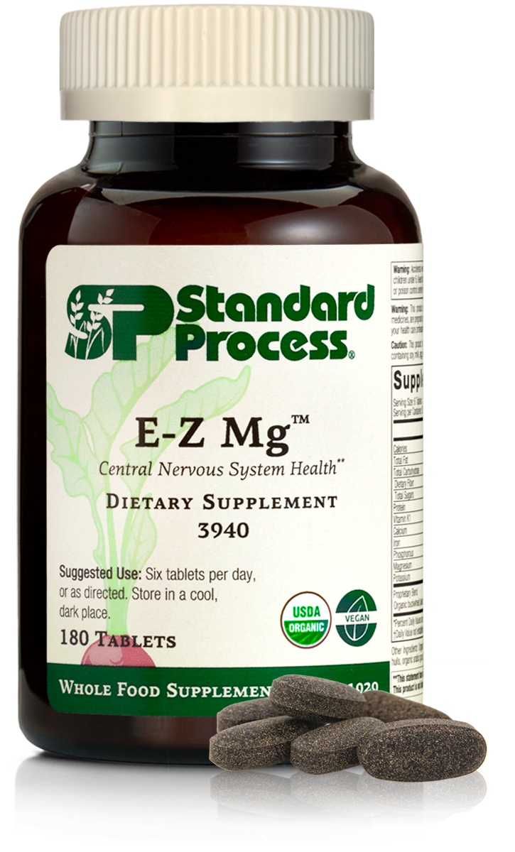 Image of E-Z Mg bottle next to tablets of magnesium supplements.